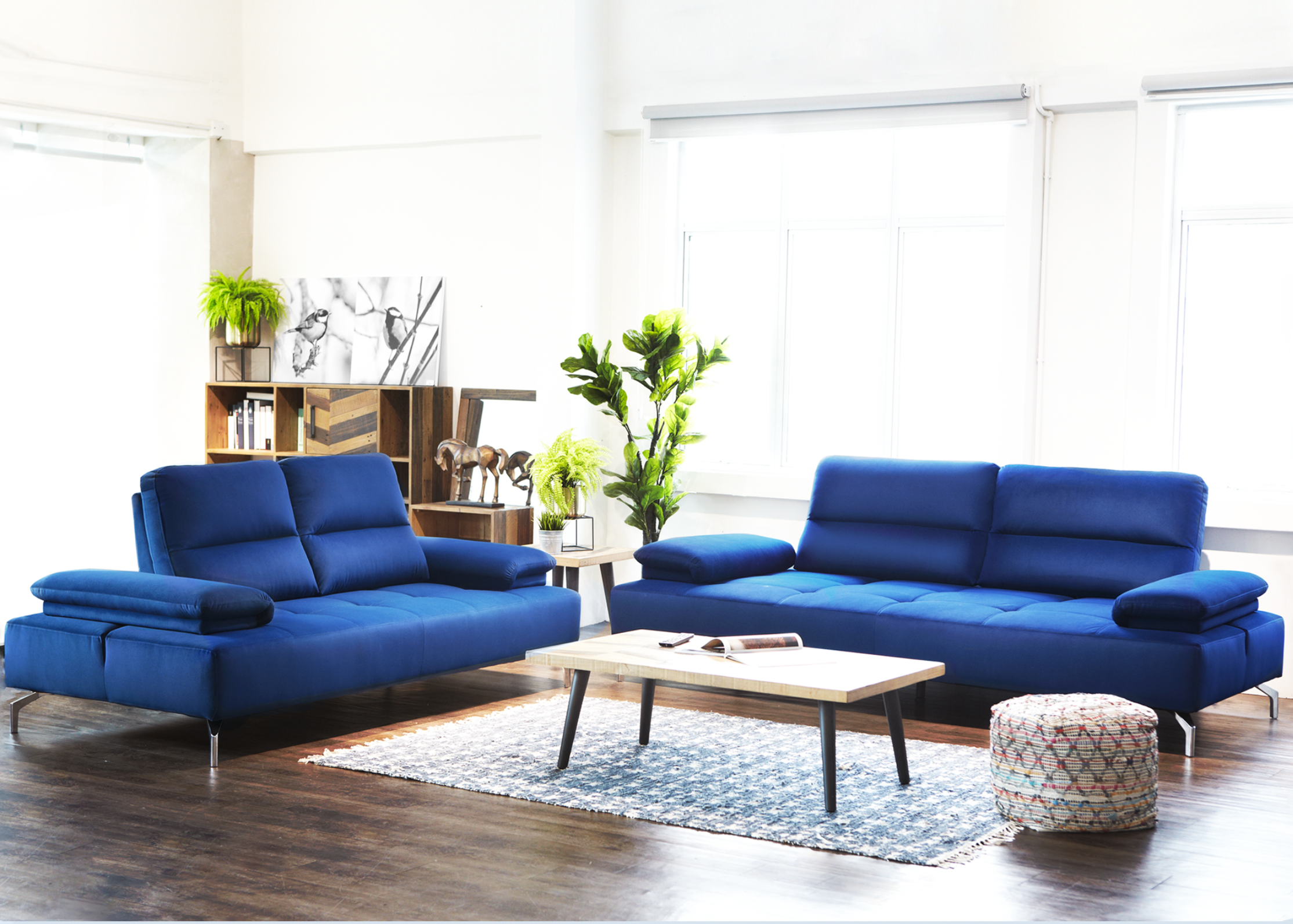 Blue sofa in a modern living room with 'HATCH' branding and product description.